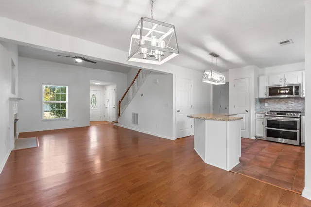 a view of a kitchen with a sink cabinets and window
