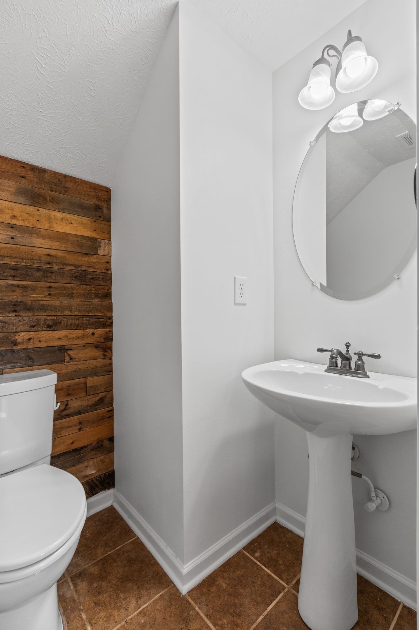 1413 Carmack Lane Spring Hill, TN 37174 - Photo 17 of 35 a bathroom with a sink a toilet and mirror