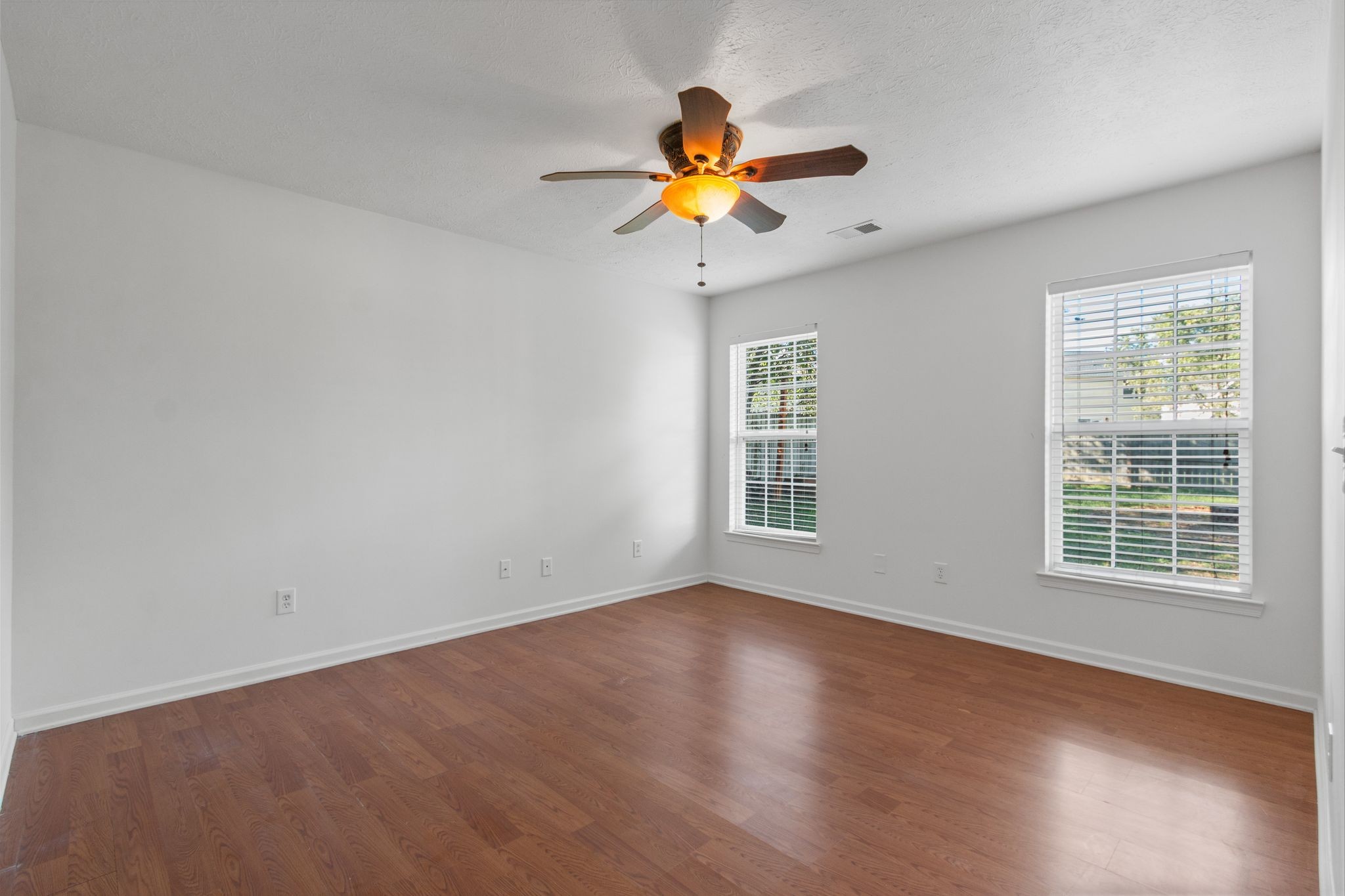 1413 Carmack Lane Spring Hill, TN 37174 - Photo 18 of 35 a view of an empty room with wooden floor and a window