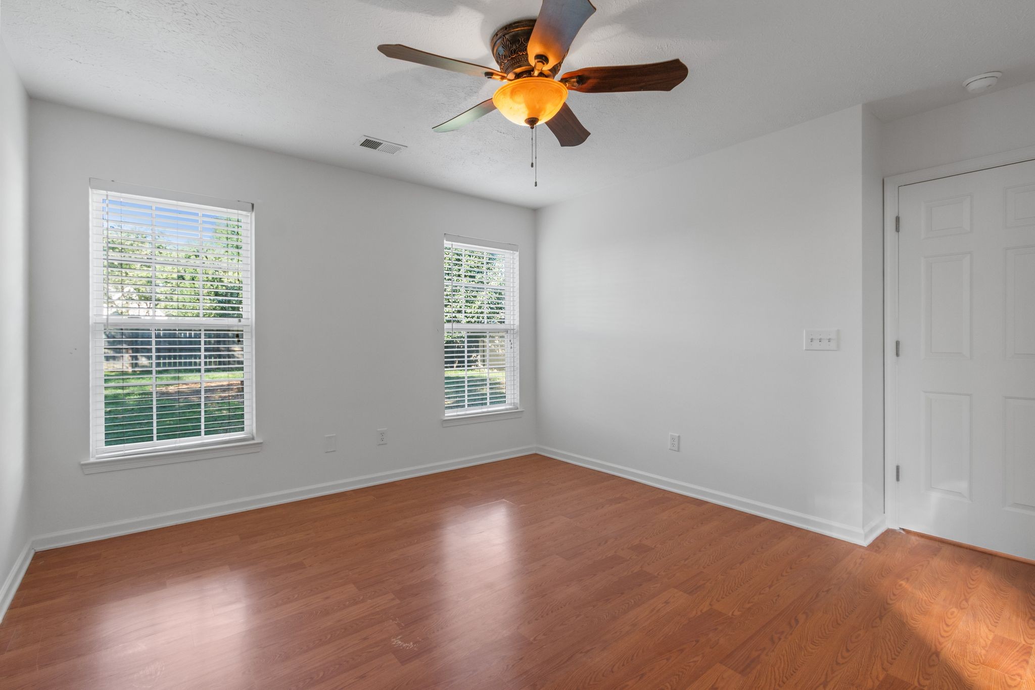 1413 Carmack Lane Spring Hill, TN 37174 - Photo 19 of 35 a view of an empty room with window and wooden floor