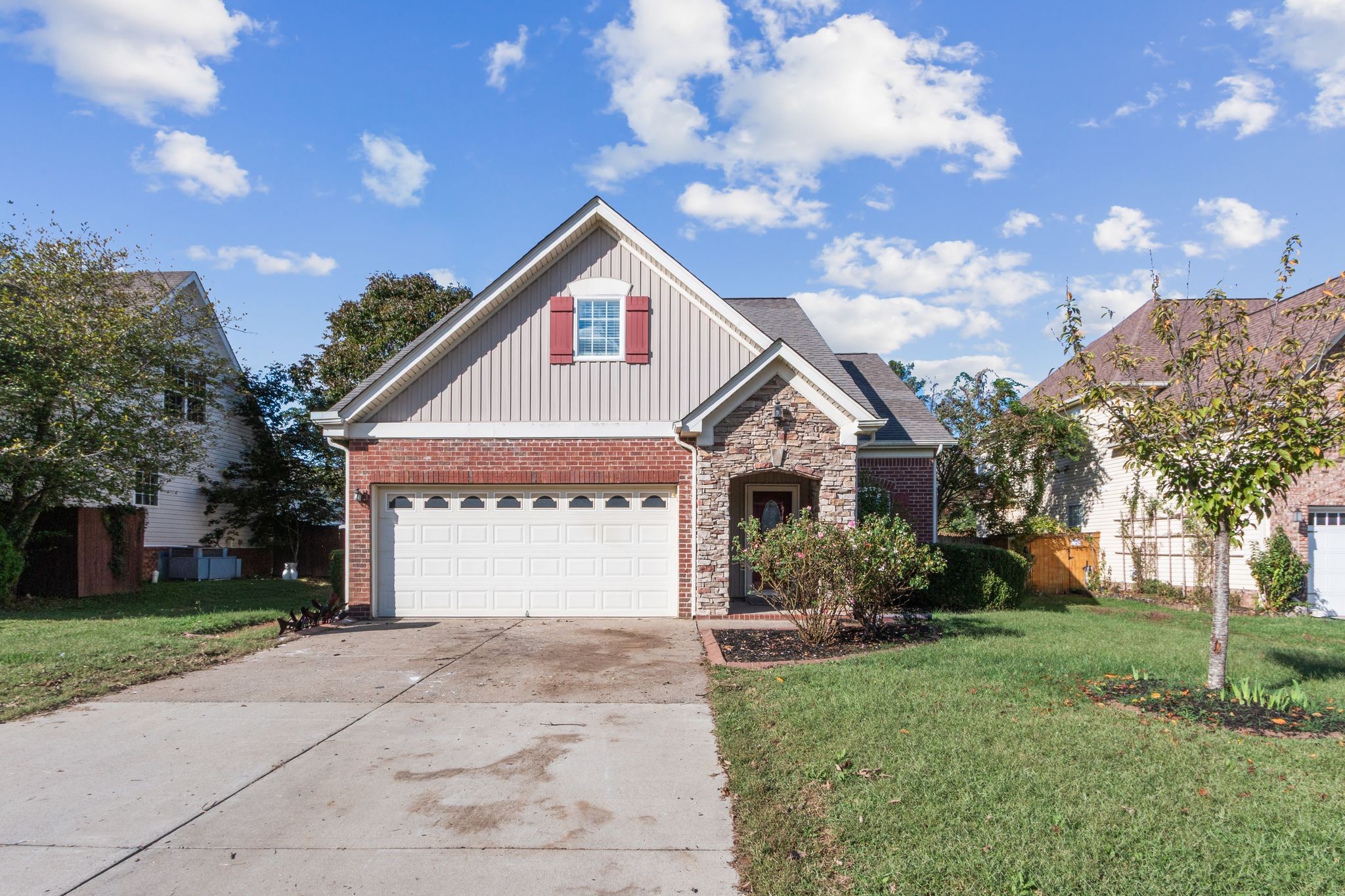 1413 Carmack Lane Spring Hill, TN 37174 - Photo 2 of 35 a front view of a house with garden