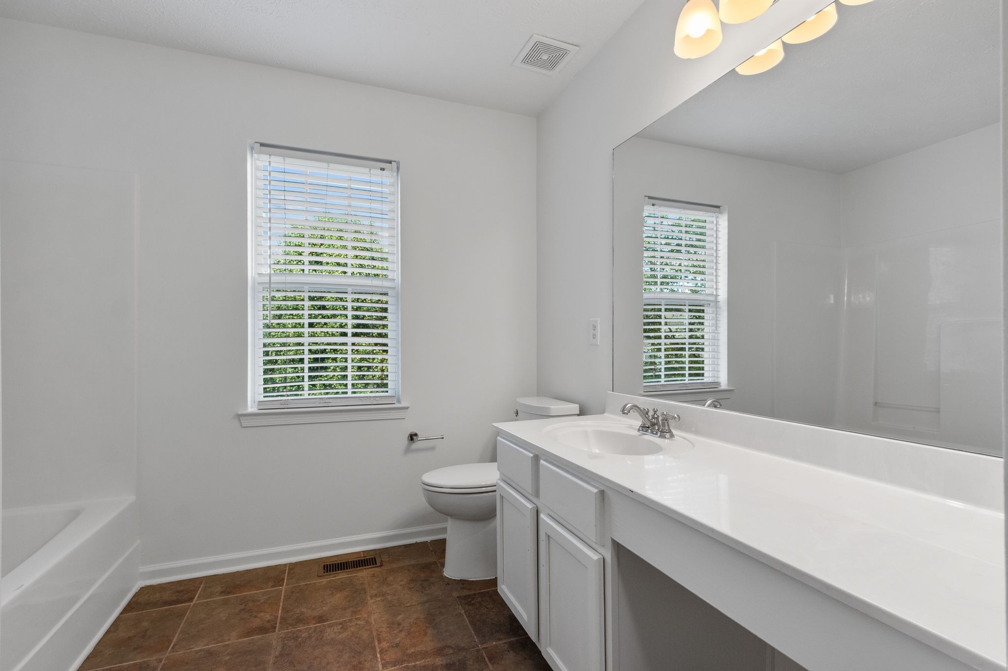 1413 Carmack Lane Spring Hill, TN 37174 - Photo 31 of 35 a bathroom with a sink a toilet and a bathtub