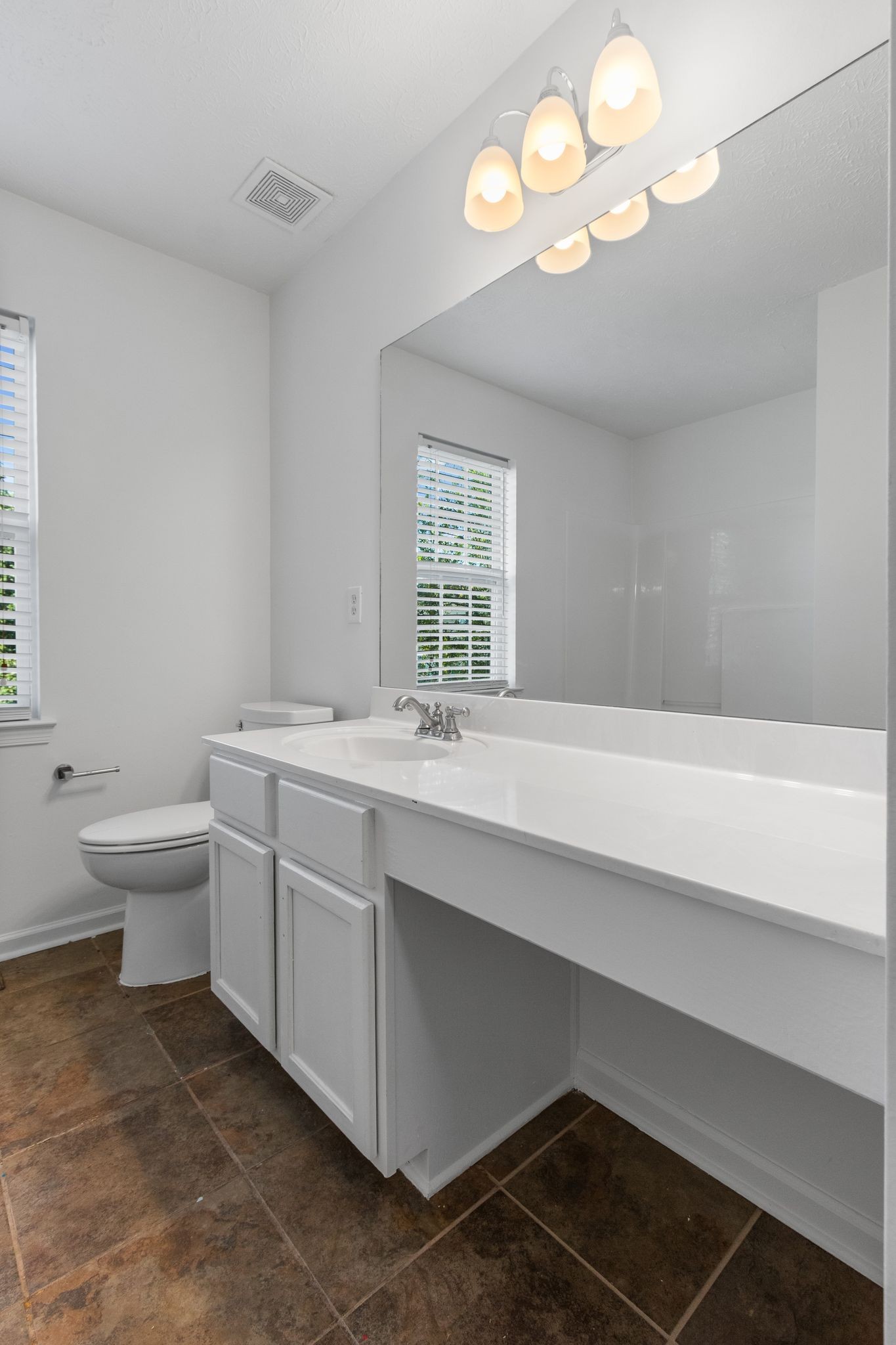 1413 Carmack Lane Spring Hill, TN 37174 - Photo 32 of 35 a bathroom with a sink a toilet and a mirror