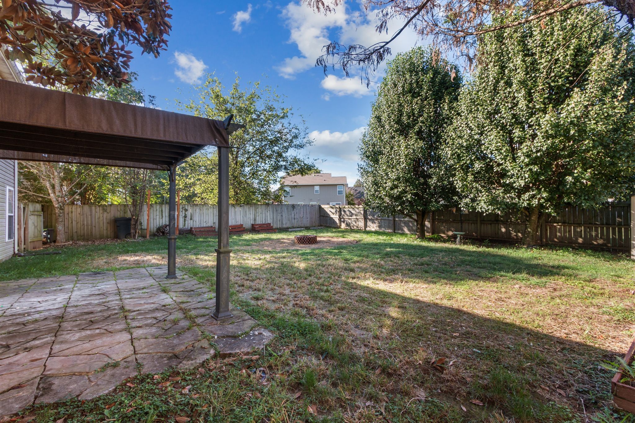 1413 Carmack Lane Spring Hill, TN 37174 - Photo 34 of 35 a view of a house with backyard and a tree