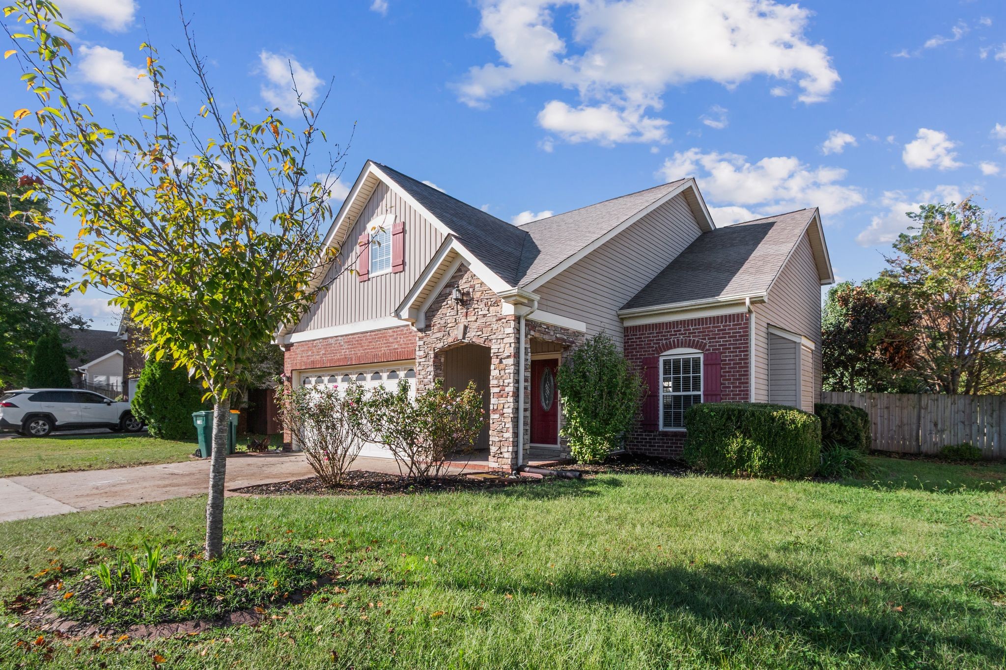 1413 Carmack Lane Spring Hill, TN 37174 - Photo 4 of 35 a front view of a house with garden