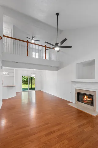 a view of an empty room with a kitchen