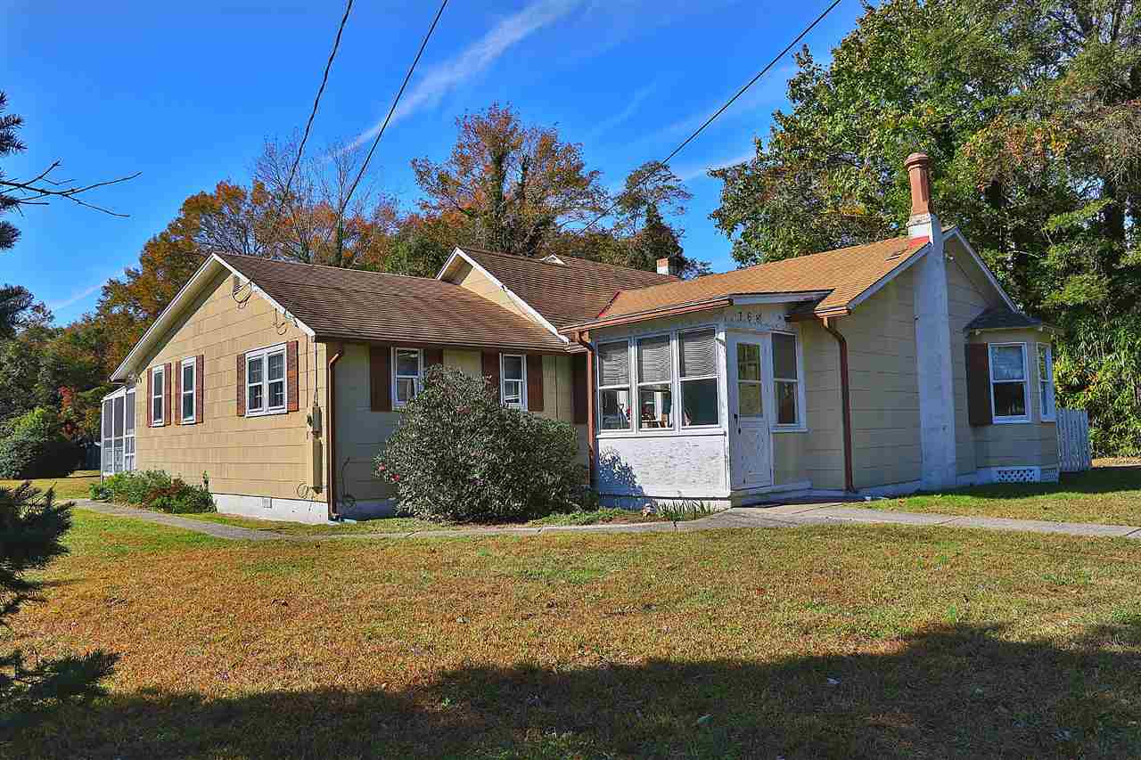 768 Academy Road Cape May, NJ 08204 - Photo 1 of 1 a front view of a house with a garden