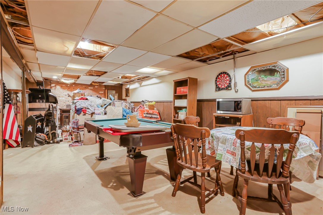 232 McGill Road Vincent, OH 45784 - Photo 32 of 49 Game room featuring a paneled ceiling, wainscoting, pool table, concrete floors, and wooden walls