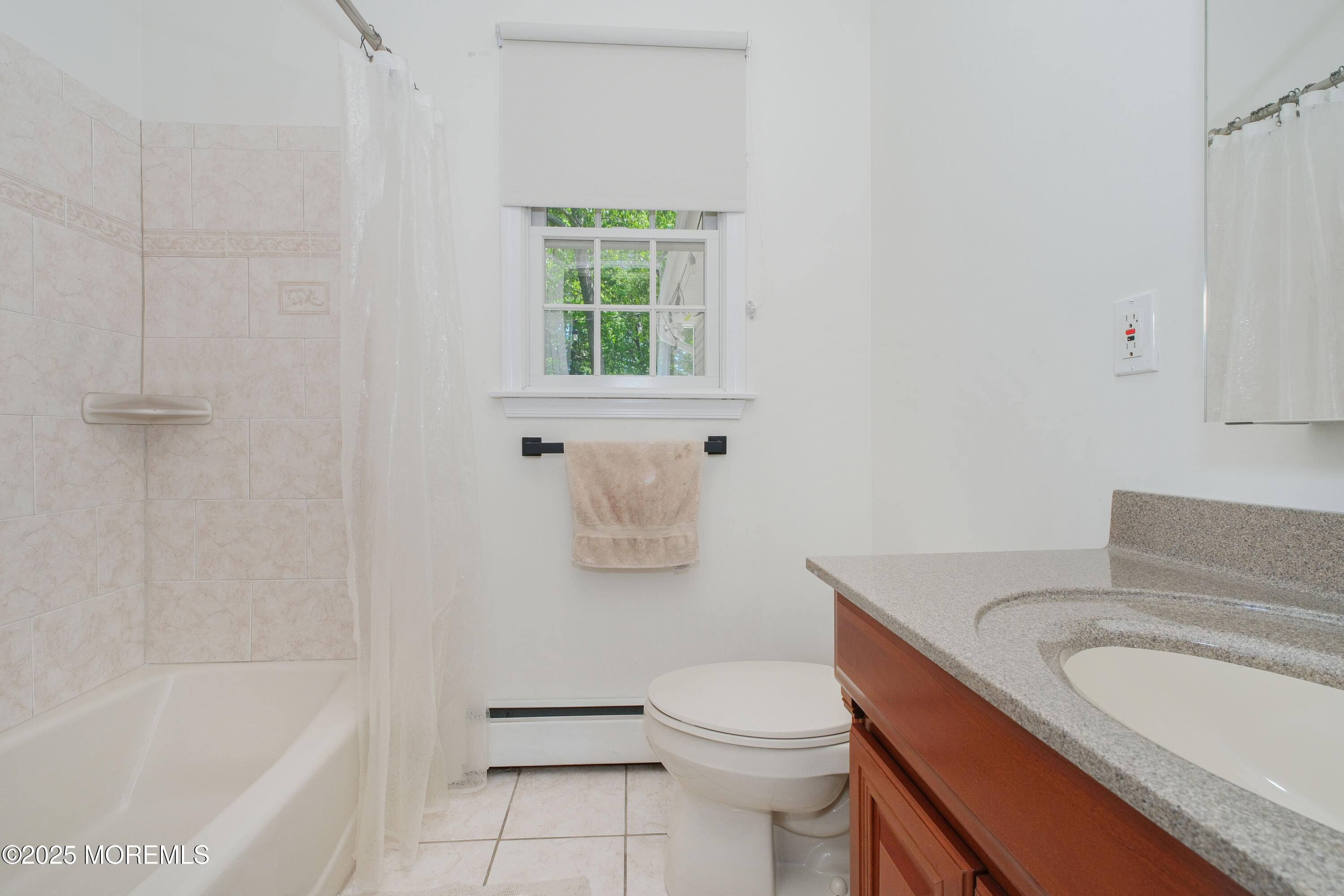 209 Woodcrest Road Oakhurst, NJ 07755 - Photo 17 of 45 a bathroom with a granite countertop toilet a sink and bathtub