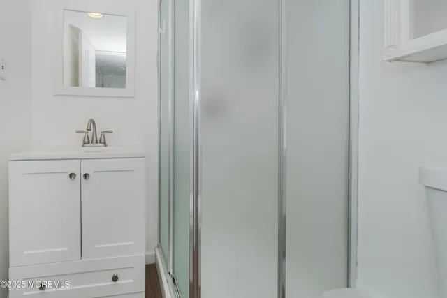 a bathroom with a sink and mirror
