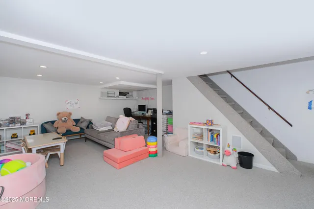 a living room with furniture and white walls