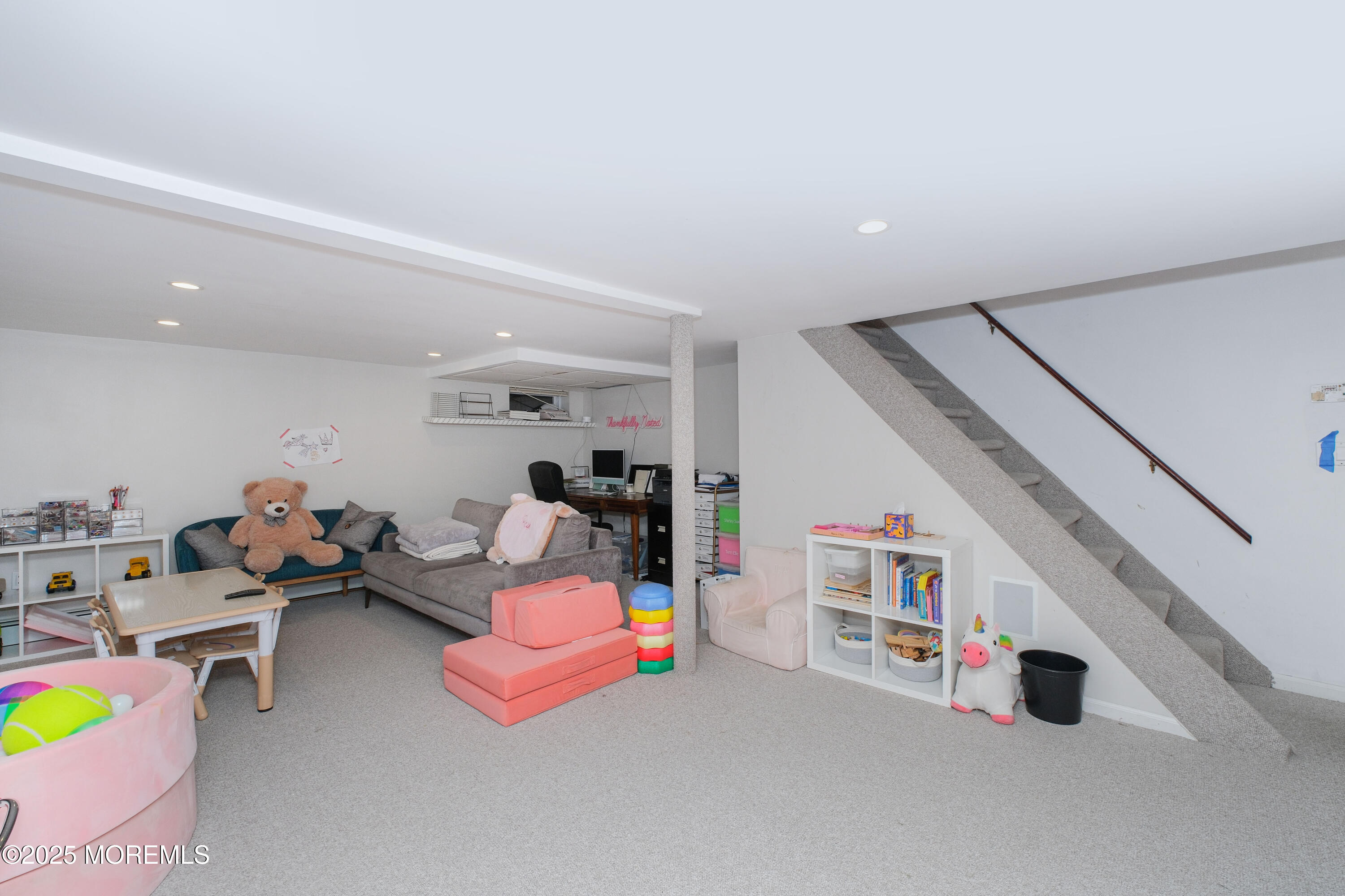 209 Woodcrest Road Oakhurst, NJ 07755 - Photo 33 of 45 a living room with furniture and white walls