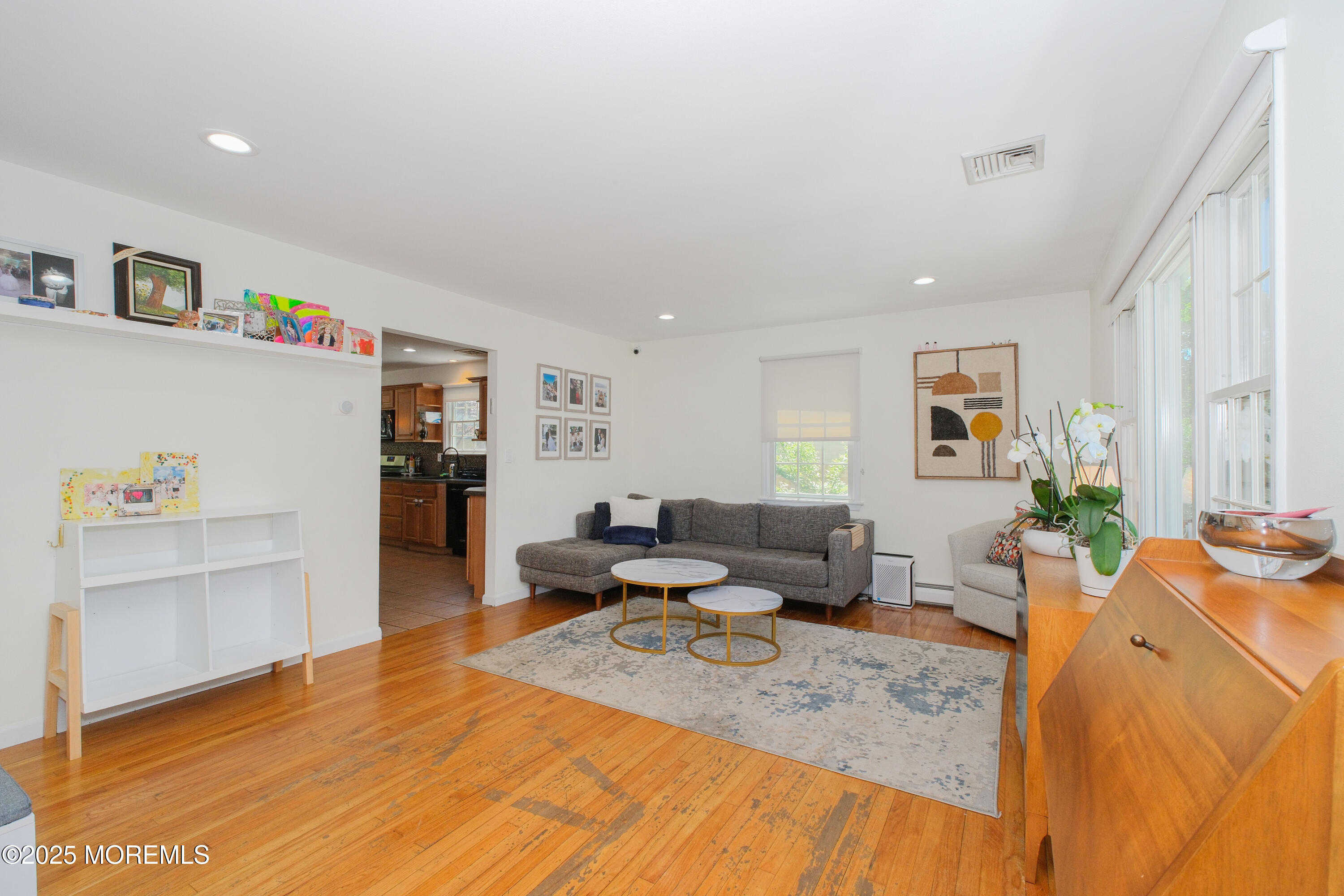 209 Woodcrest Road Oakhurst, NJ 07755 - Photo 7 of 45 a living room with furniture and a wooden floor
