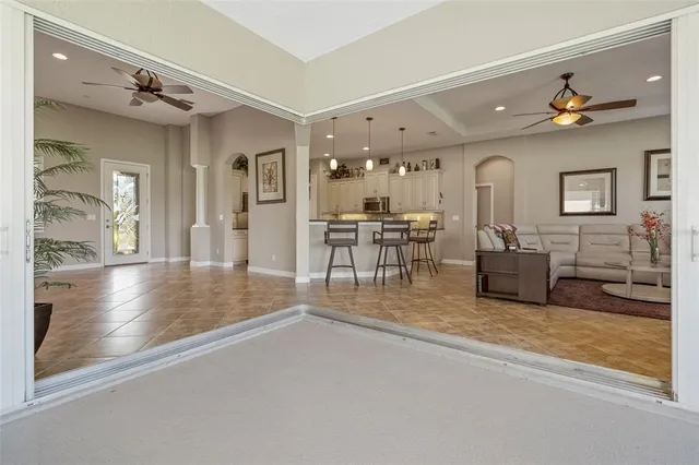 a view of a livingroom with furniture and a flat screen tv