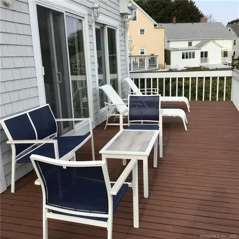 a view of a balcony with chairs