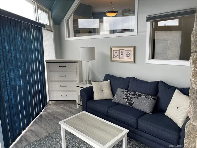 a living room with furniture and window