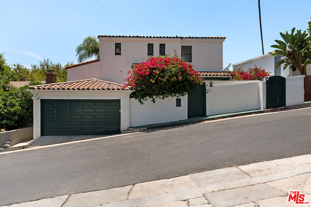 a front view of a house with a garage