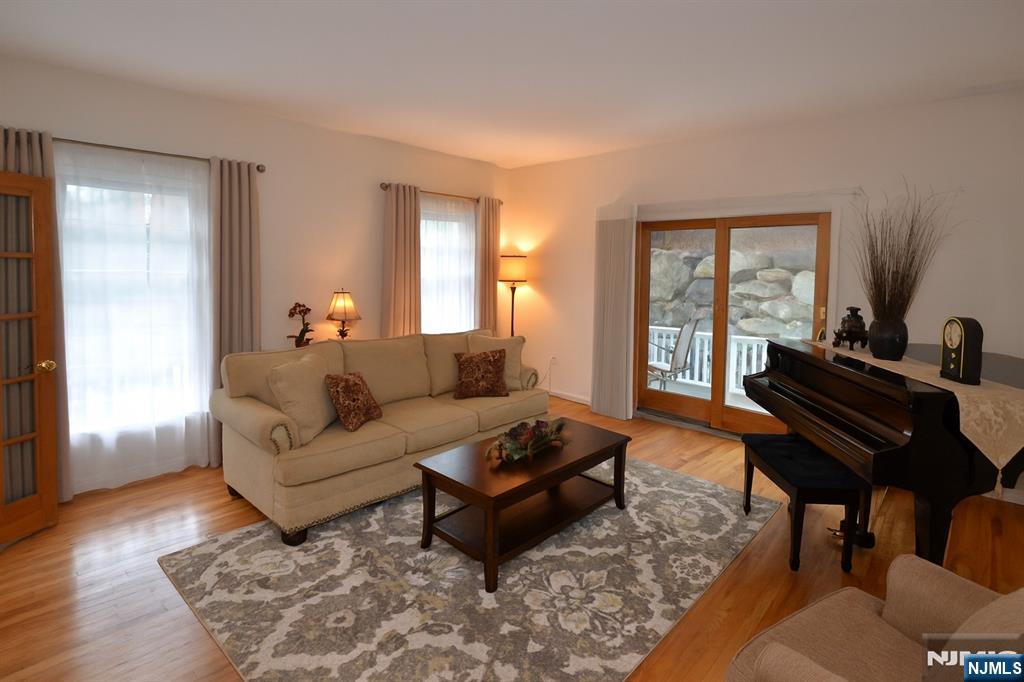 2 Upper Lake Road Oak Ridge, NJ 07438 - Photo 11 of 50 a living room with furniture a rug and a window
