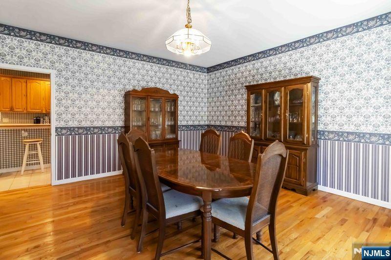 2 Upper Lake Road Oak Ridge, NJ 07438 - Photo 13 of 50 a view of a dining room with furniture and wooden floor