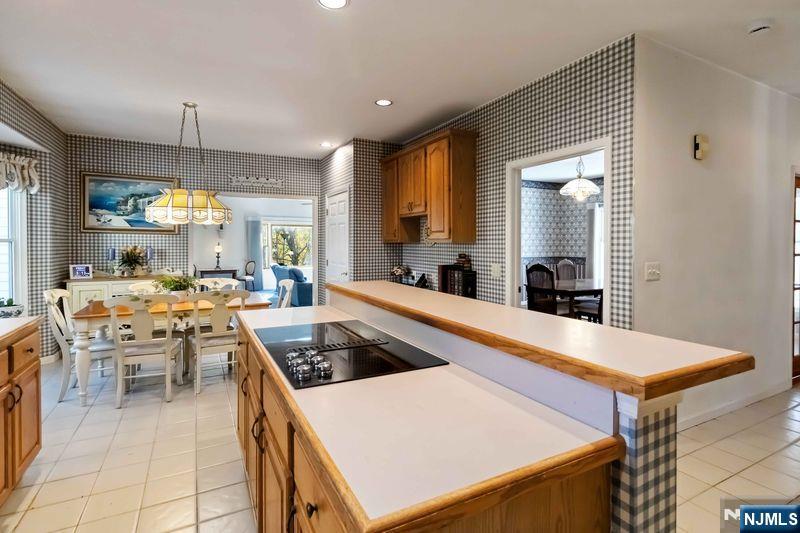 2 Upper Lake Road Oak Ridge, NJ 07438 - Photo 14 of 50 a large kitchen with a table and chairs in it
