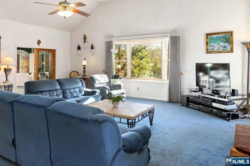 2 Upper Lake Road Oak Ridge, NJ 07438 - Photo 18 of 50 a living room with furniture and a flat screen tv