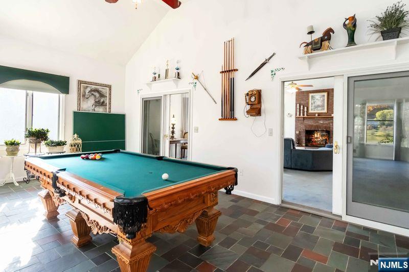 2 Upper Lake Road Oak Ridge, NJ 07438 - Photo 21 of 50 a room with pool table and windows