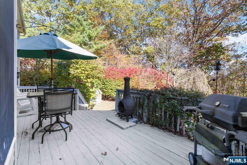 2 Upper Lake Road Oak Ridge, NJ 07438 - Photo 22 of 50 a view of a deck with furniture and a yard
