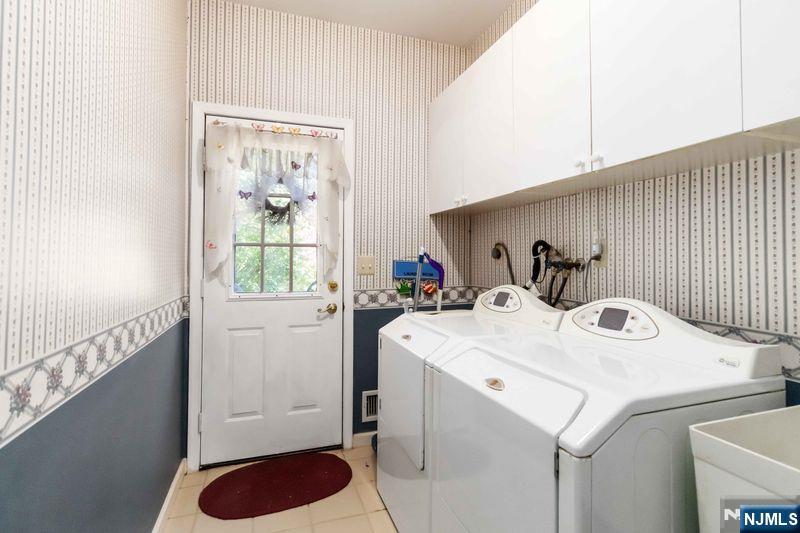2 Upper Lake Road Oak Ridge, NJ 07438 - Photo 25 of 50 a utility room with dryer and washer