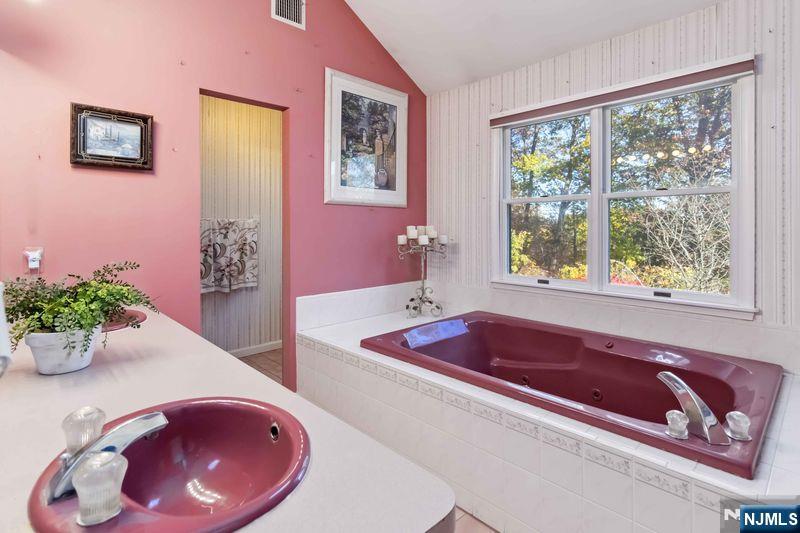2 Upper Lake Road Oak Ridge, NJ 07438 - Photo 28 of 50 a bath room with a tub and potted plant