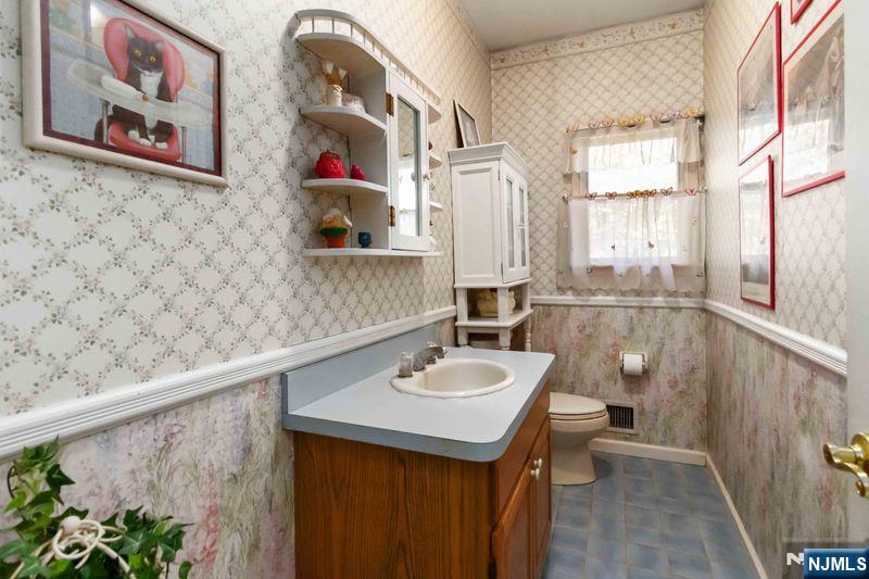 2 Upper Lake Road Oak Ridge, NJ 07438 - Photo 29 of 50 a bathroom with a sink and a mirror