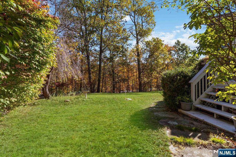 2 Upper Lake Road Oak Ridge, NJ 07438 - Photo 40 of 50 a big yard with lots of green space and trees