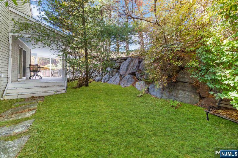 2 Upper Lake Road Oak Ridge, NJ 07438 - Photo 41 of 50 a backyard of a house with lots of green space