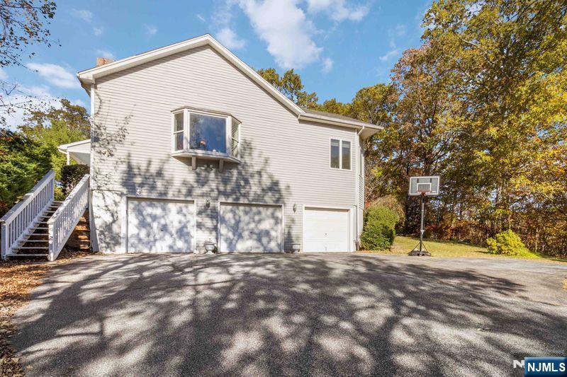 2 Upper Lake Road Oak Ridge, NJ 07438 - Photo 42 of 50 a view of a house with a yard