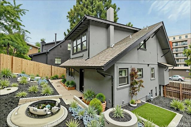 a house with lots of trees in the background