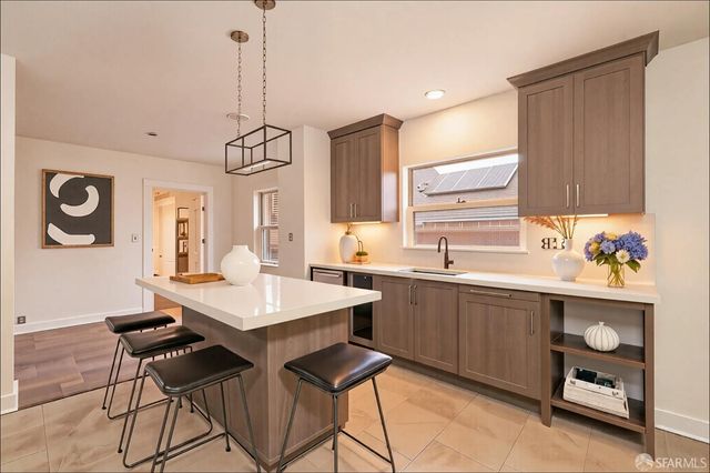 a kitchen with a table and chairs in it