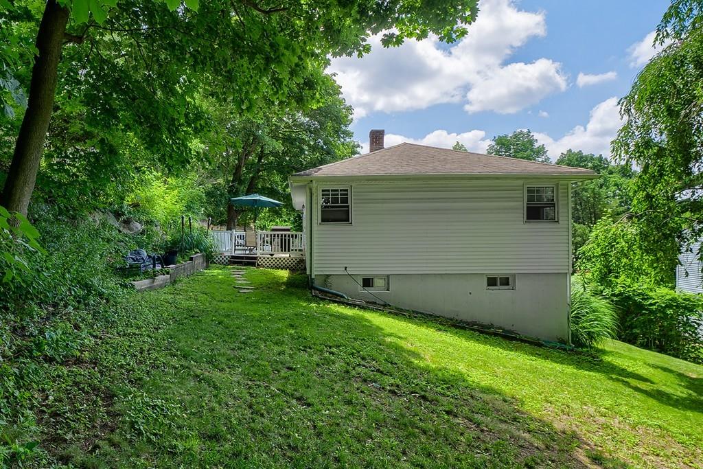 54 Manhattan Road Worcester, MA 01602 - Photo 17 of 19 a view of a backyard with potted plants and large tree