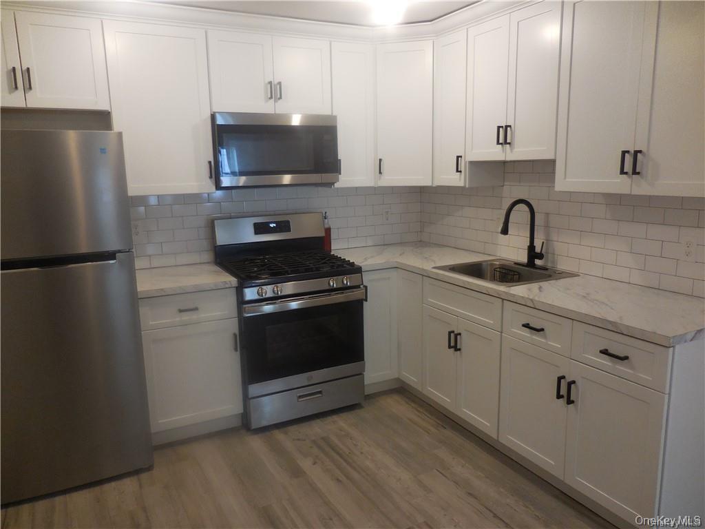 67 Main Street, Unit 2B Walden, NY 12586 - Photo 2 of 18 With stainless steel appliances, refrigerator,microway, oven/range.