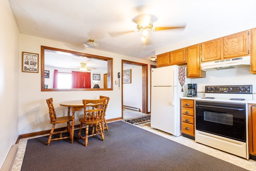 170 Perry Avenue, Unit 3A Worcester, MA 01610 - Photo 8 of 16 a view of a kitchen with furniture and a ceiling fan