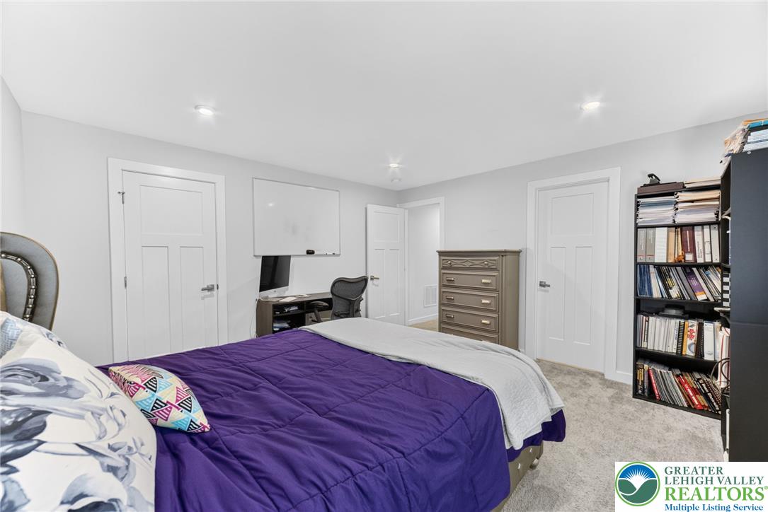 3952 Orth Street Bethlehem, PA 18020 - Photo 46 of 60 A comfortable bedroom features plush carpeting and functional built-in storage solutions.