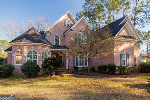 a front view of a house with swimming pool