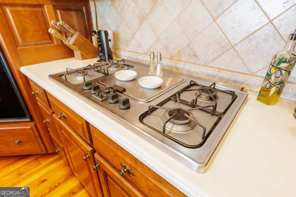 a kitchen with a sink and a wooden cabinets