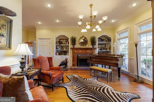 a view of a livingroom with furniture and a large window