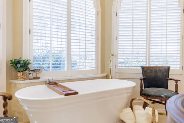 a bedroom with a bed and furniture