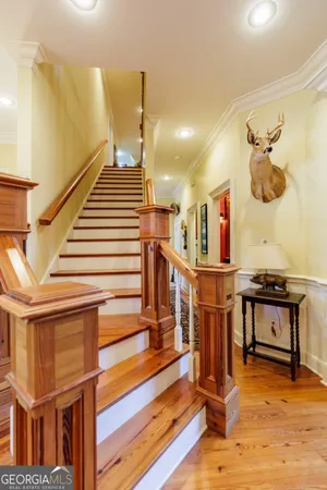 a bathroom with a shower sink and mirror