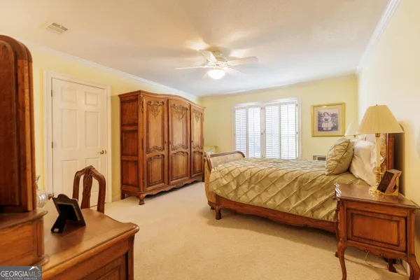 a dining room with furniture window and wooden floor