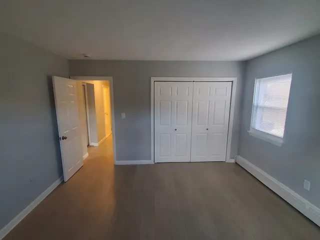 a view of a livingroom with wooden floor