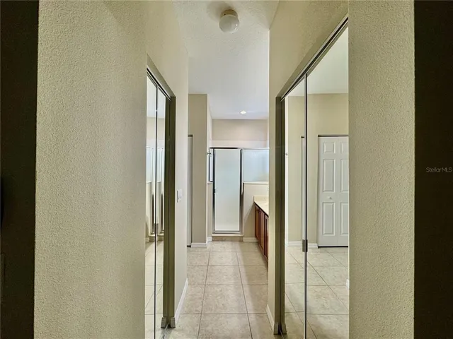 a view of a bathroom from a hallway