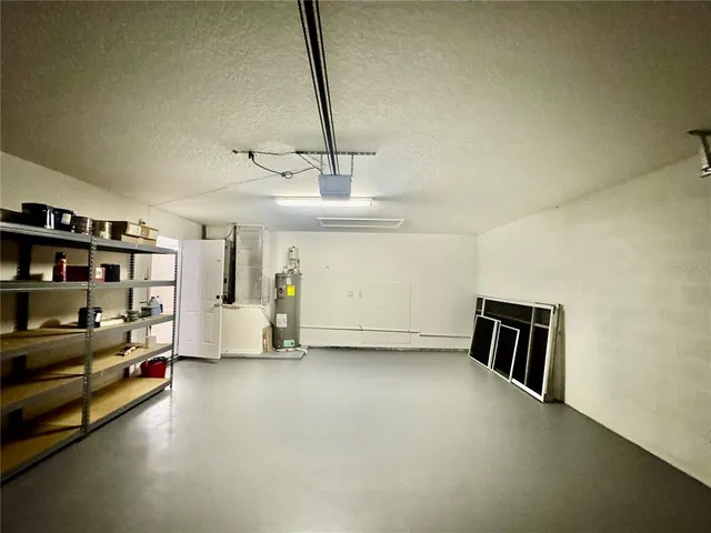 a view of a livingroom with furniture and a window