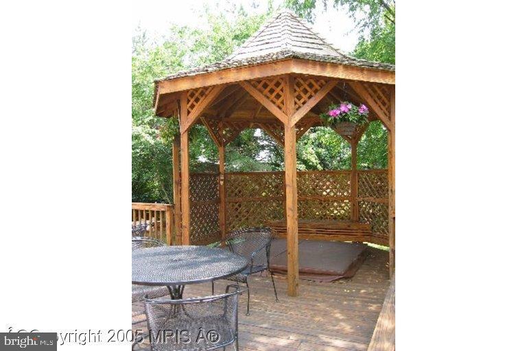 6397 True Lane Springfield, VA 22150 - Photo 2 of 6 a view of a porch with a table and chairs
