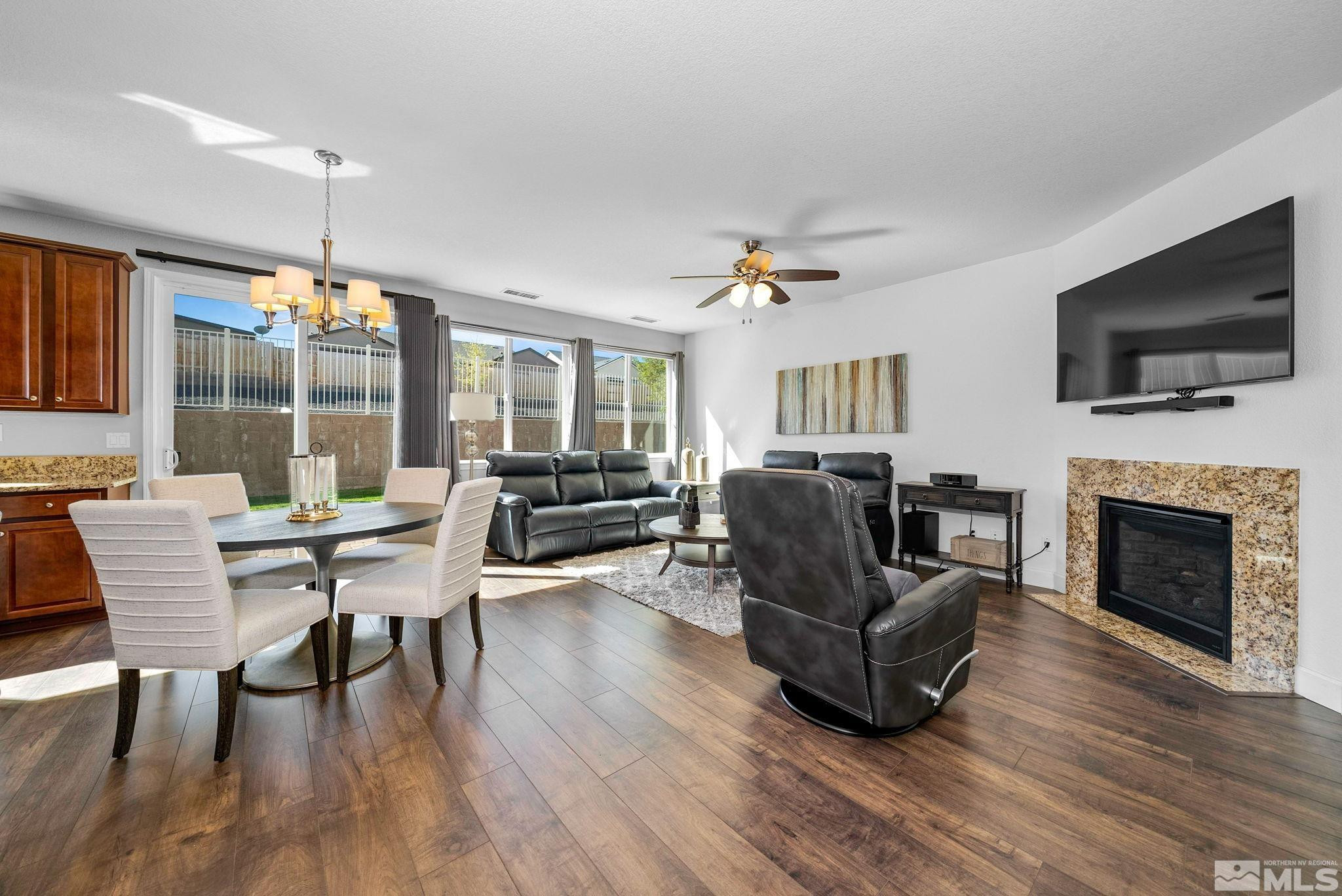 2040 Whitecliff Drive Reno, NV 89521 - Photo 9 of 35 a living room with furniture a flat screen tv and a fireplace